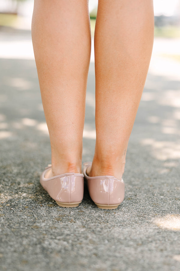 Plus Size blush patent leather ballet flats with a round toe and a delicate bow detail.