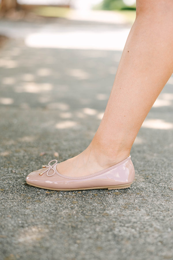 Plus Size blush patent leather ballet flats with a round toe and a delicate bow detail.