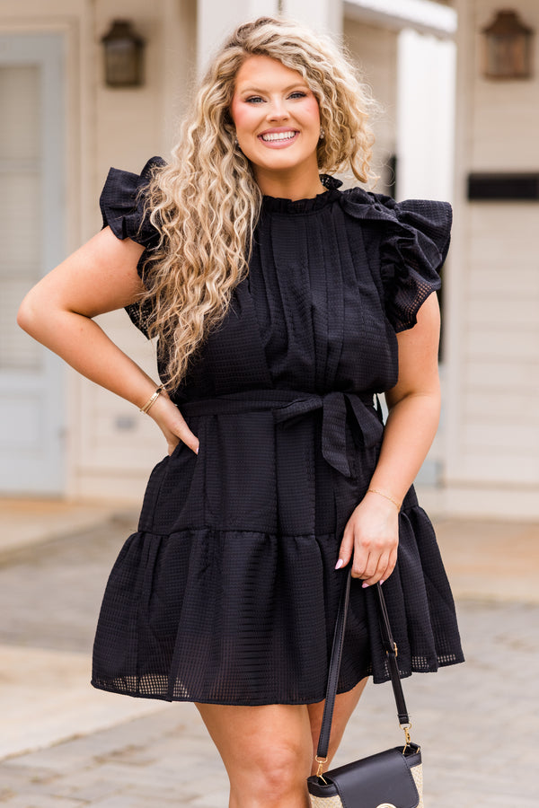 Chic Soul plus size clothing, black dress with ruffles, pleated neckline, and waist tie