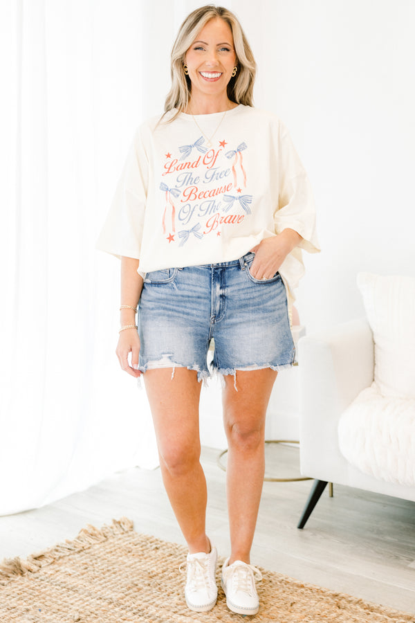 Chic Soul plus size clothing, short-sleeve ivory white drop-shoulder boyfriend tee with a high-scoop-neckline with a red and blue graphic calligraphy stating 