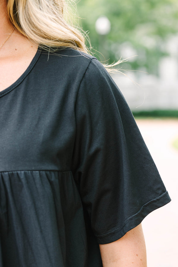 Chic Soul plus size clothing, black short sleeve flowy top with round neckline with cinch along chest with ruffle stripe detail along bottom