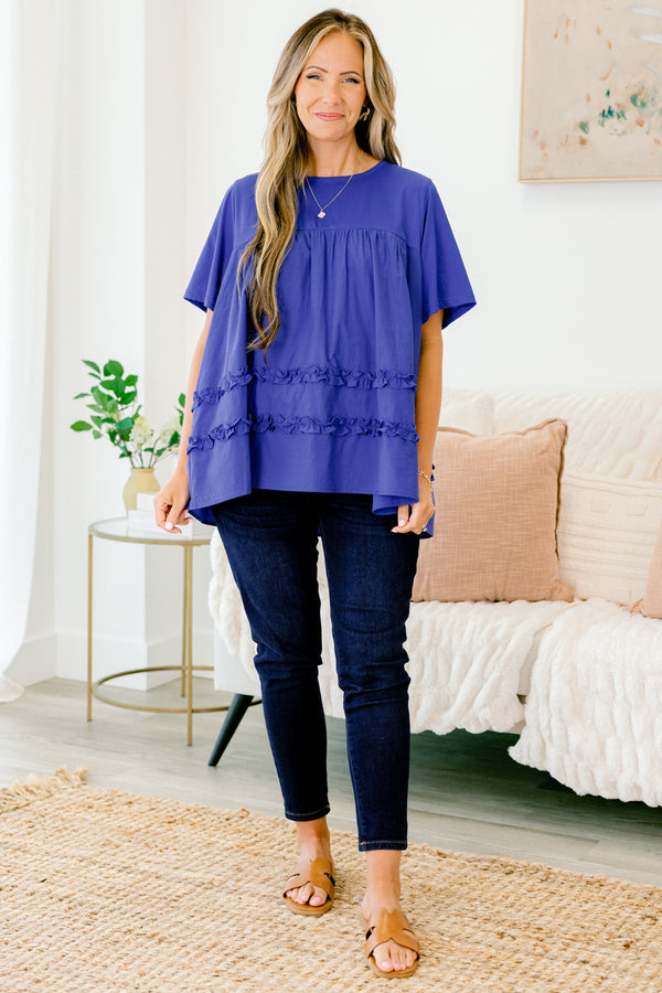 Chic Soul Plus size clothing, blue short sleeve blouse with ruffle detailing the bottom of the shirt 
