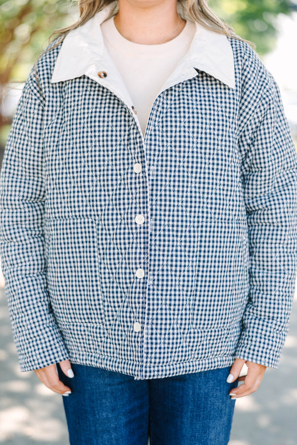 Plus size navy gingham reversible quilted coat with a taupe lining and button front.