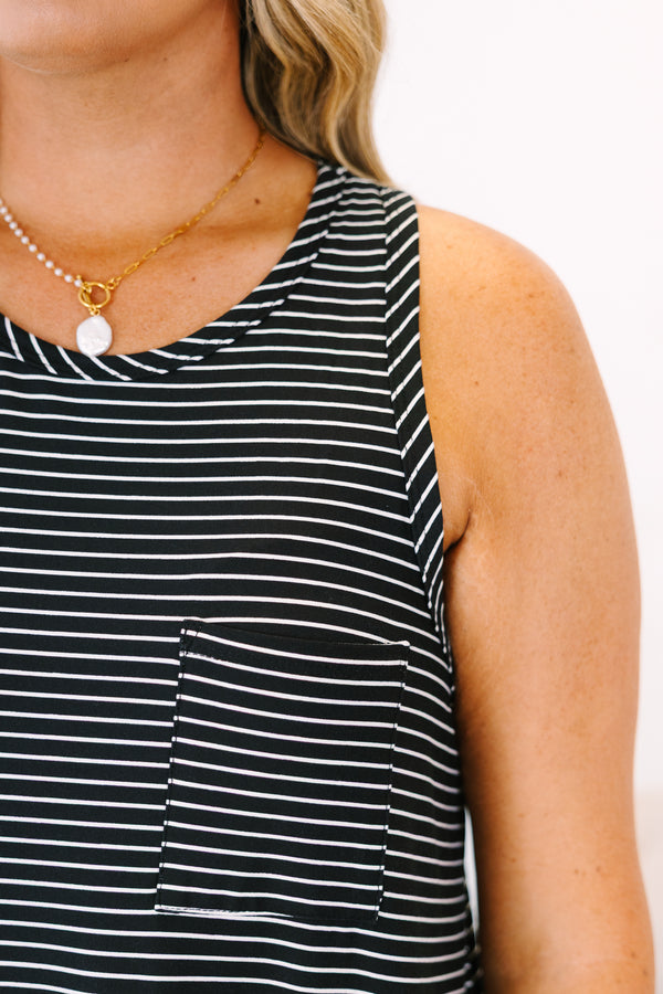 Plus Size black and ivory striped sleeveless swing dress with a racerback and front pockets.