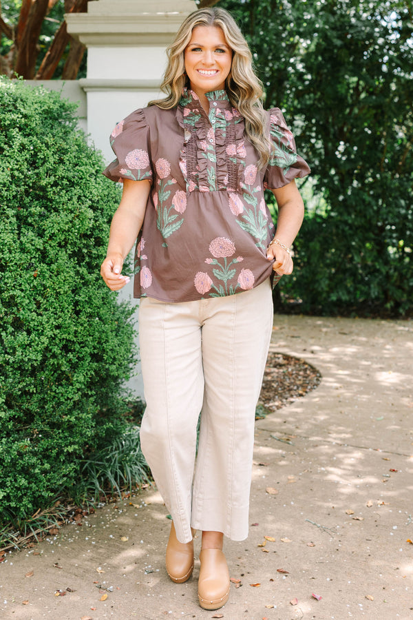 Plus size brown floral top with pink botanical print, ruffled high neck, and short puff sleeves.