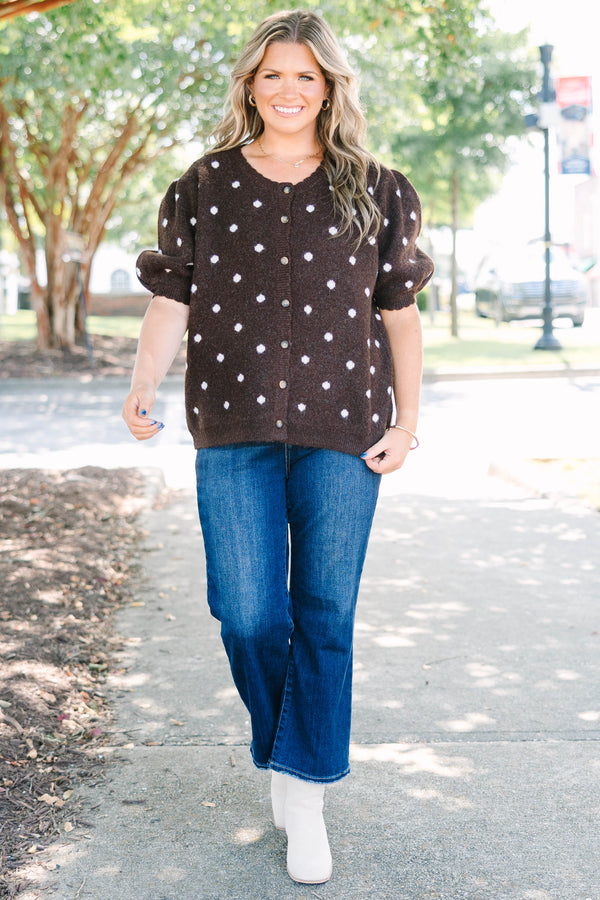 Plus Size brown cardigan with white polka dots, short puff sleeves, and a button-front closure.