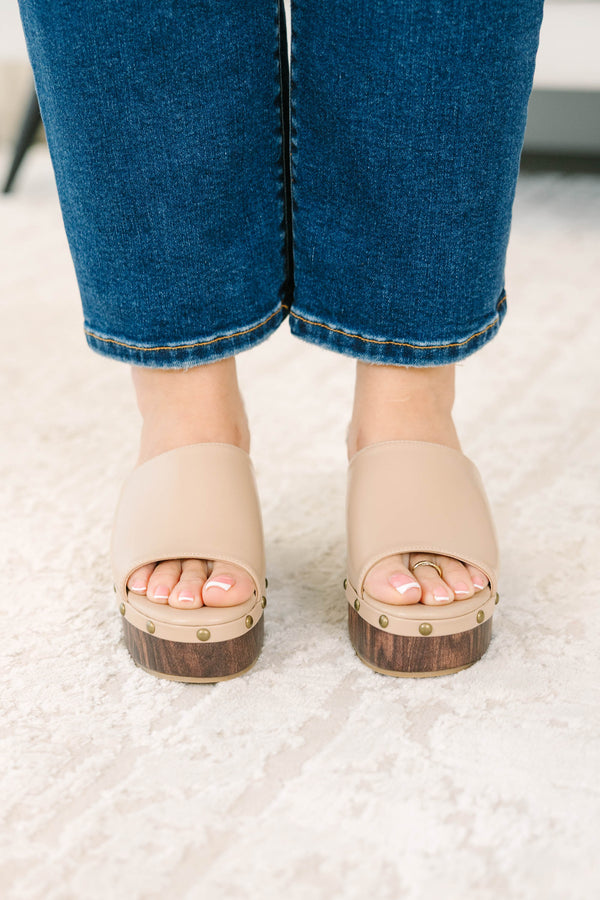 Plus Size brown faux leather wedge sandals with a wood-grain platform and stud details.