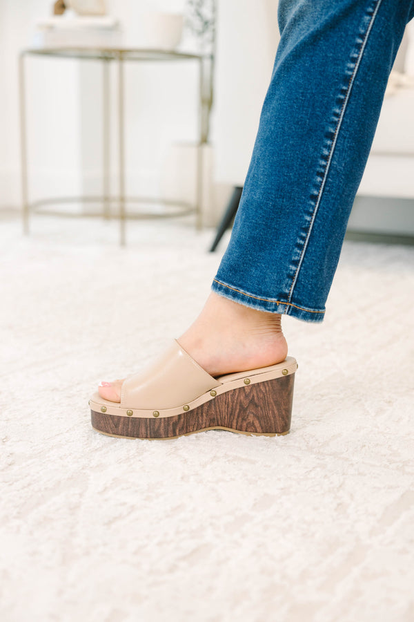 Plus Size brown faux leather wedge sandals with a wood-grain platform and stud details.