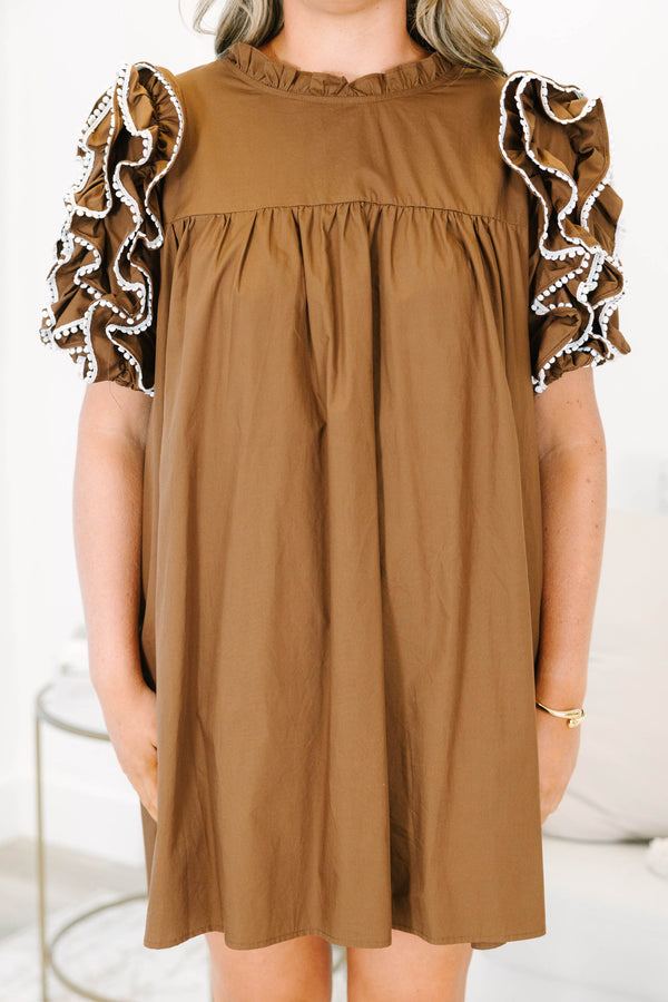 Plus Size brown cotton mini dress with ruffled high neck and tiered puff sleeves with white trim.