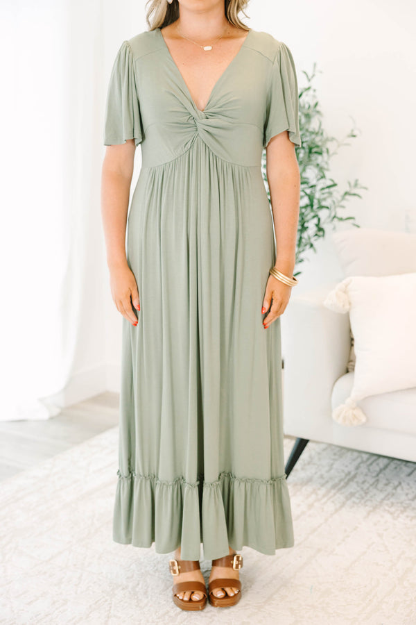 Plus Size olive maxi dress with a twist-front V-neckline, flutter sleeves, and a ruffled hem.