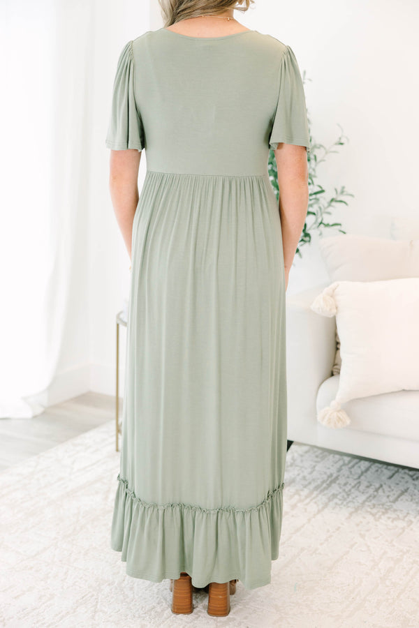 Plus Size olive maxi dress with a twist-front V-neckline, flutter sleeves, and a ruffled hem.