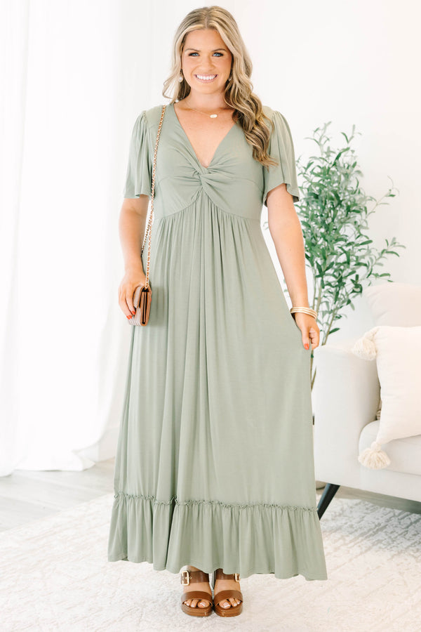 Plus Size olive maxi dress with a twist-front V-neckline, flutter sleeves, and a ruffled hem.