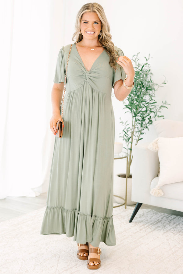 Plus Size olive maxi dress with a twist-front V-neckline, flutter sleeves, and a ruffled hem.