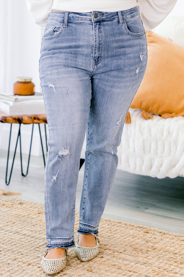 Chic Soul plus size clothing, light washed straight jeans with distressed details on each pant leg and small fringe details at the end of the jeans 