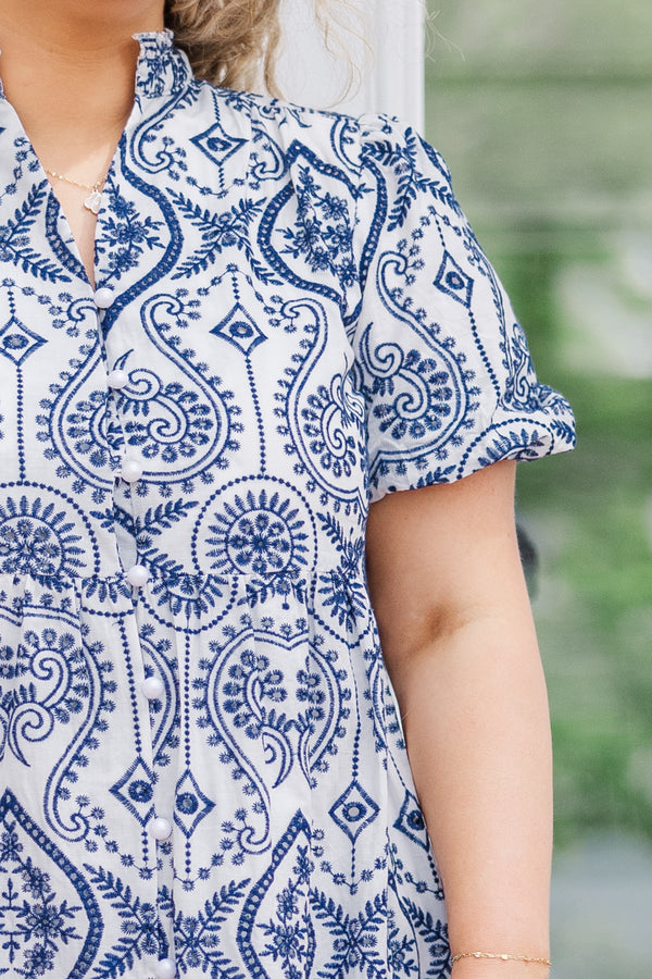 Plus Size navy and white embroidered cotton dress with bubble sleeves and a ruffled hem.
