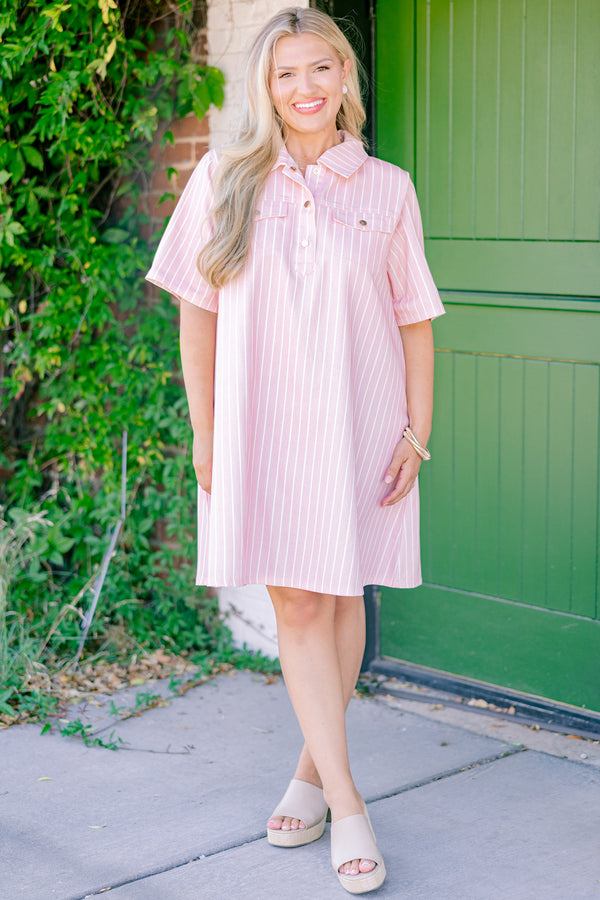Chic Soul plus size clothing, pink dress with white stripes going down the dress two front pockets and a button up neckline 