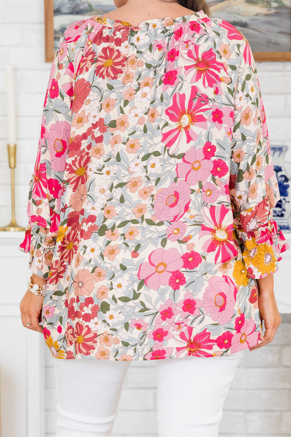 Chic Soul plus size clothing, pink floral top long sleeves that have a ruffle detail at the end of each sleeve and a v-neckline 