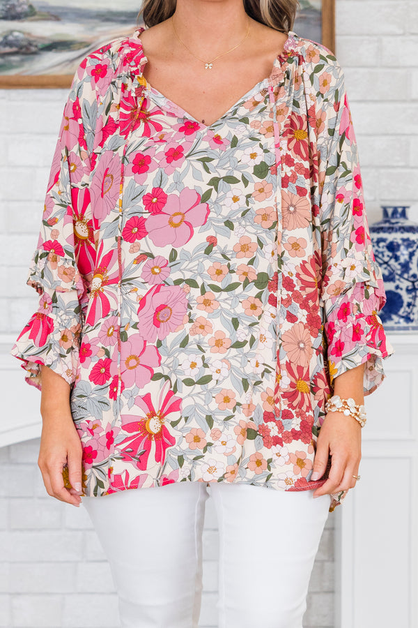 Chic Soul plus size clothing, pink floral top long sleeves that have a ruffle detail at the end of each sleeve and a v-neckline 