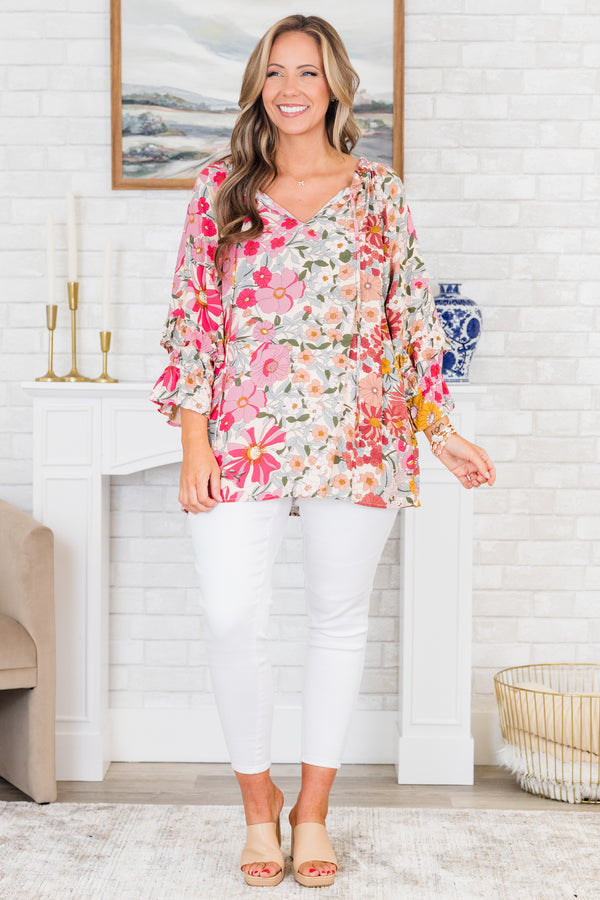 Chic Soul plus size clothing, pink floral top long sleeves that have a ruffle detail at the end of each sleeve and a v-neckline 