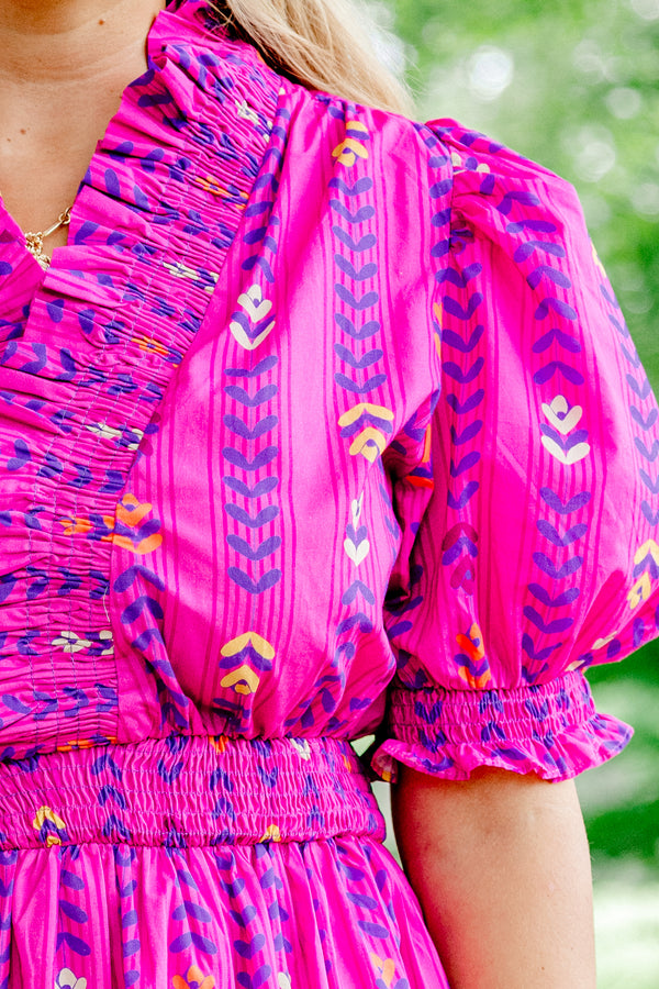 Chic Soul Plus size clothing, magenta block pattern maxi dress with bubble sleeves that have a ruffle detail at the end of the sleeves and along the neckline, as well as a ruched waistband 
