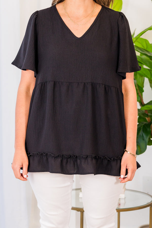 Chic Soul plus size clothing, black short sleeve top with v neckline and flutter sleeves with ruffle along the bottom