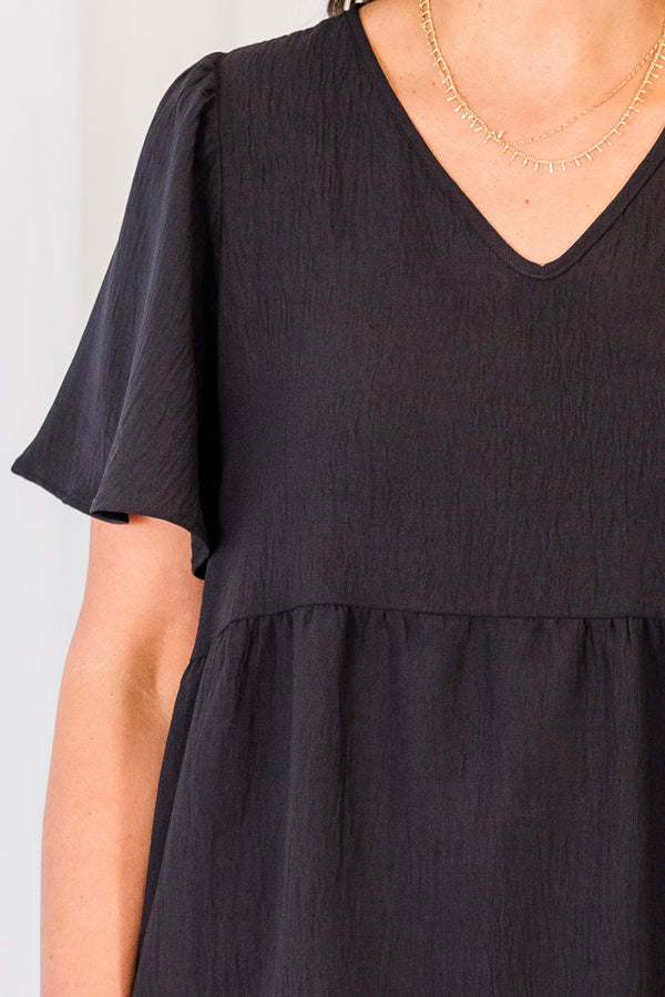 Chic Soul plus size clothing, black short sleeve top with v neckline and flutter sleeves with ruffle along the bottom