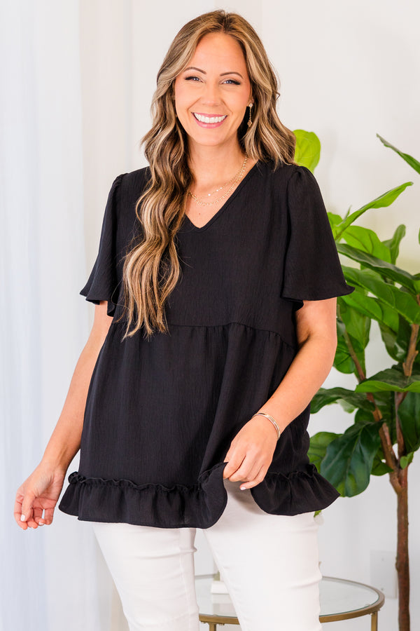Chic Soul plus size clothing, black short sleeve top with v neckline and flutter sleeves with ruffle along the bottom