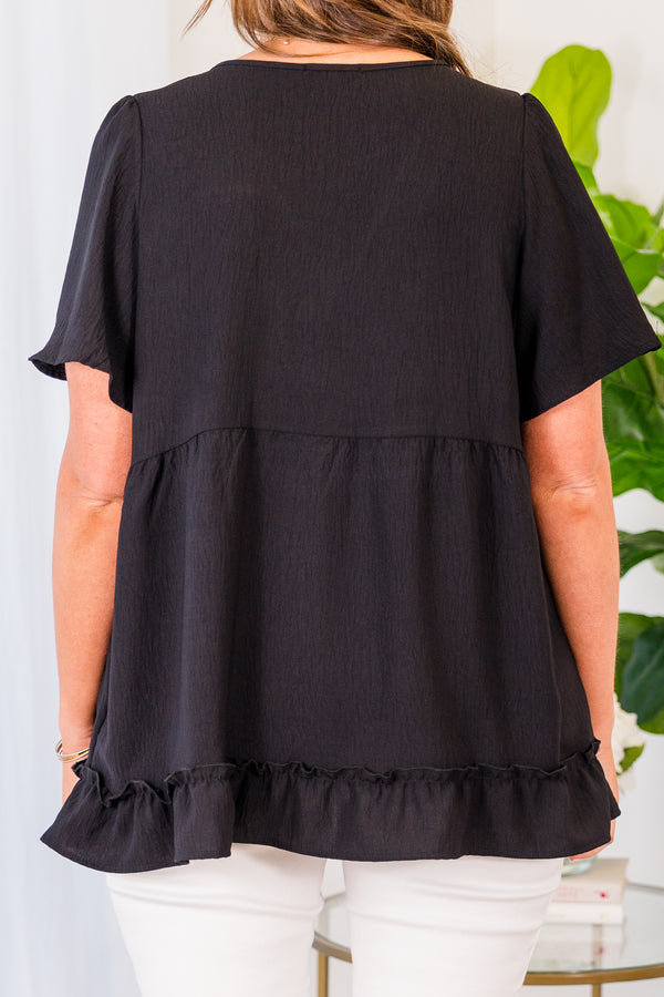Chic Soul plus size clothing, black short sleeve top with v neckline and flutter sleeves with ruffle along the bottom