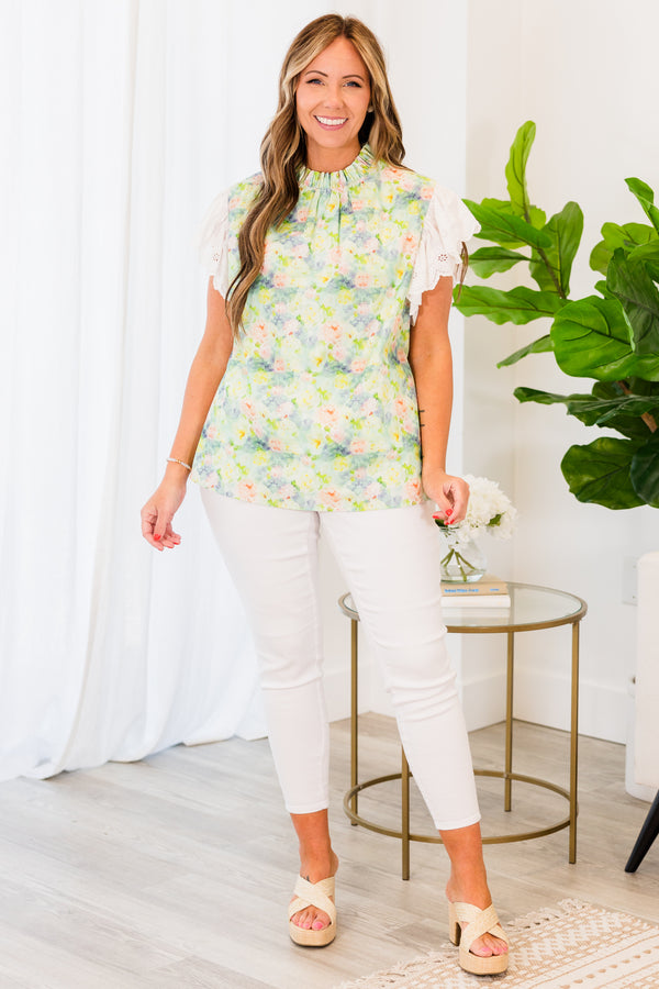Chic Soul plus size clothing, white short-flutter-sleeve sage green top with a ruffled mock neck and a subtle watercolor floral pattern