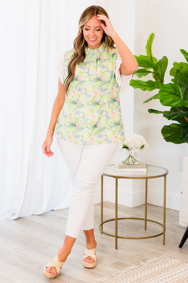 Chic Soul plus size clothing, white short-flutter-sleeve sage green top with a ruffled mock neck and a subtle watercolor floral pattern