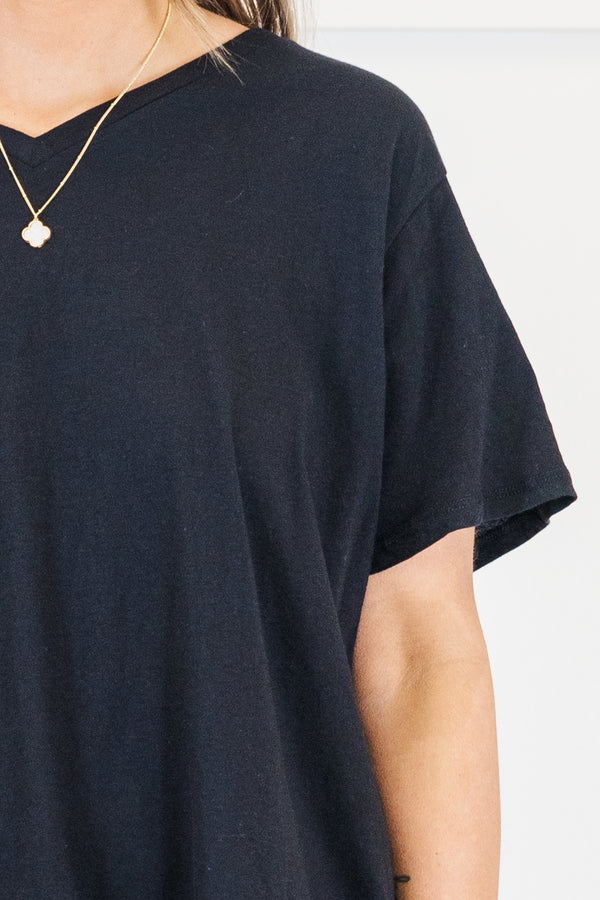 Plus Size black v-neck short sleeve cotton tee paired with white denim shorts.