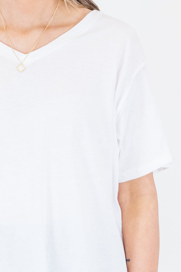 Plus Size white v-neck short sleeve cotton tee with light wash distressed denim shorts.