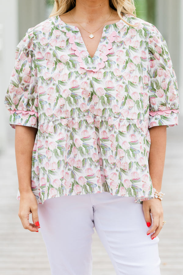 Chic Soul plus size clothing, white elbow length short sleeve top with v cutout along round neckline with pink scalloped detail along neckline and detail along cuff sleeves with pink and green tulip print 