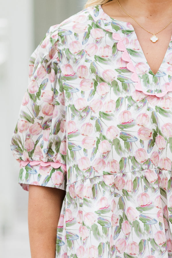 Chic Soul plus size clothing, white elbow length short sleeve top with v cutout along round neckline with pink scalloped detail along neckline and detail along cuff sleeves with pink and green tulip print 