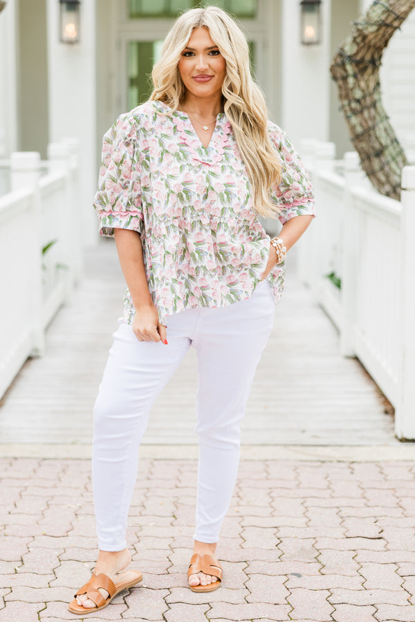 Chic Soul plus size clothing, white elbow length short sleeve top with v cutout along round neckline with pink scalloped detail along neckline and detail along cuff sleeves with pink and green tulip print 
