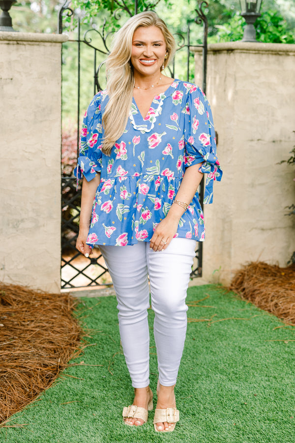 Chic Soul plus size clothing, blue short sleeve babydoll top with pink floral pattern, bow tie sleeves, and white scallop v-neck