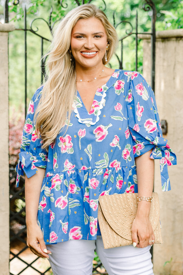Chic Soul plus size clothing, blue short sleeve babydoll top with pink floral pattern, bow tie sleeves, and white scallop v-neck