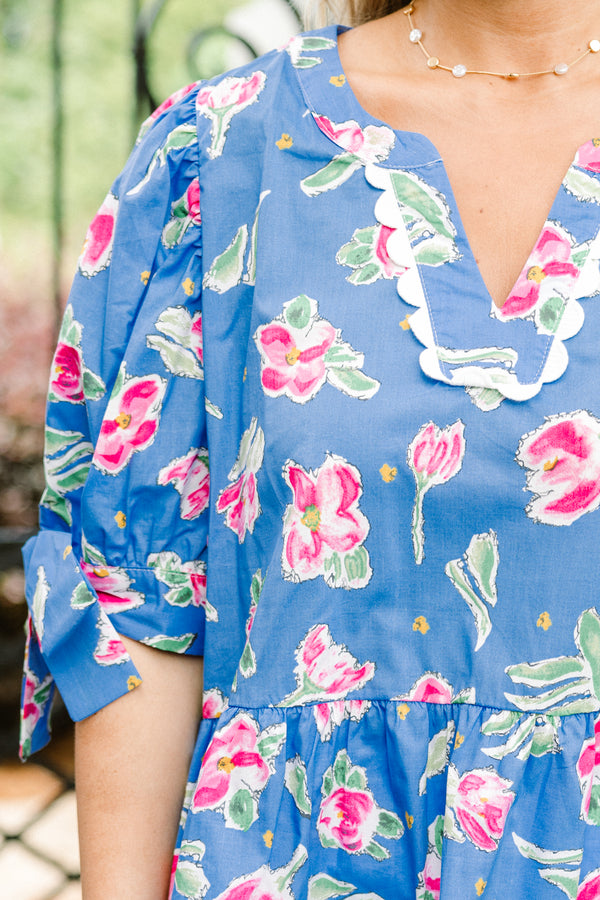 Chic Soul plus size clothing, blue short sleeve babydoll top with pink floral pattern, bow tie sleeves, and white scallop v-neck