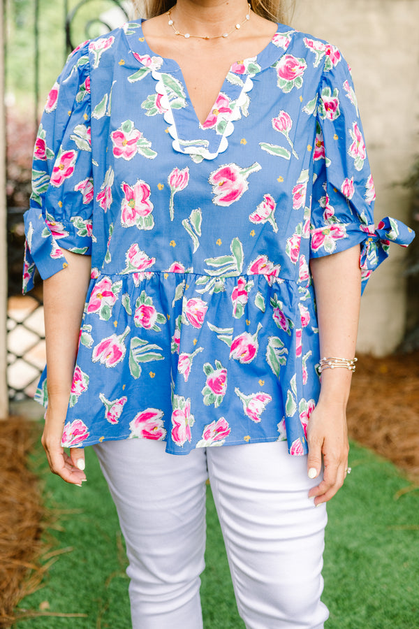 Chic Soul plus size clothing, blue short sleeve babydoll top with pink floral pattern, bow tie sleeves, and white scallop v-neck