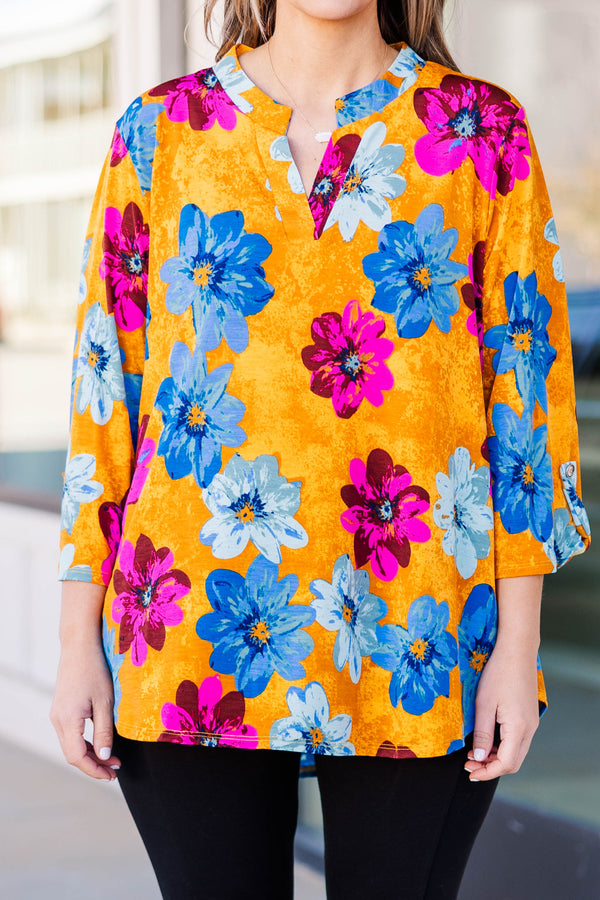 Chic soul plus size boutique, golden yellow floral top with magenta, deep blue, and light blue floral print, 3/4 quarter length sleeves, v-neck slit at the top