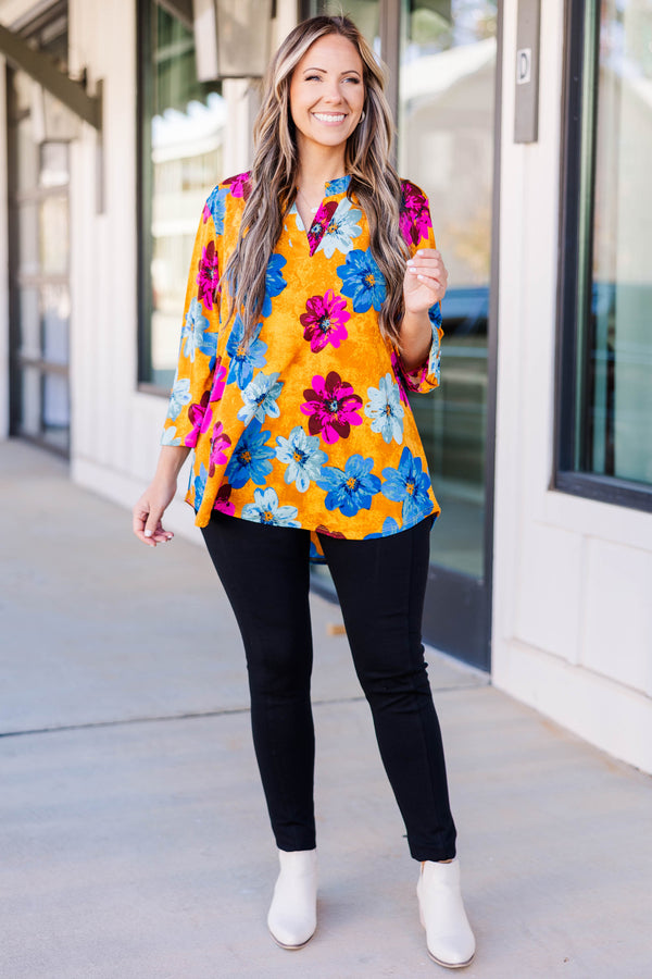 Chic soul plus size boutique, golden yellow floral top with magenta, deep blue, and light blue floral print, 3/4 quarter length sleeves, v-neck slit at the top