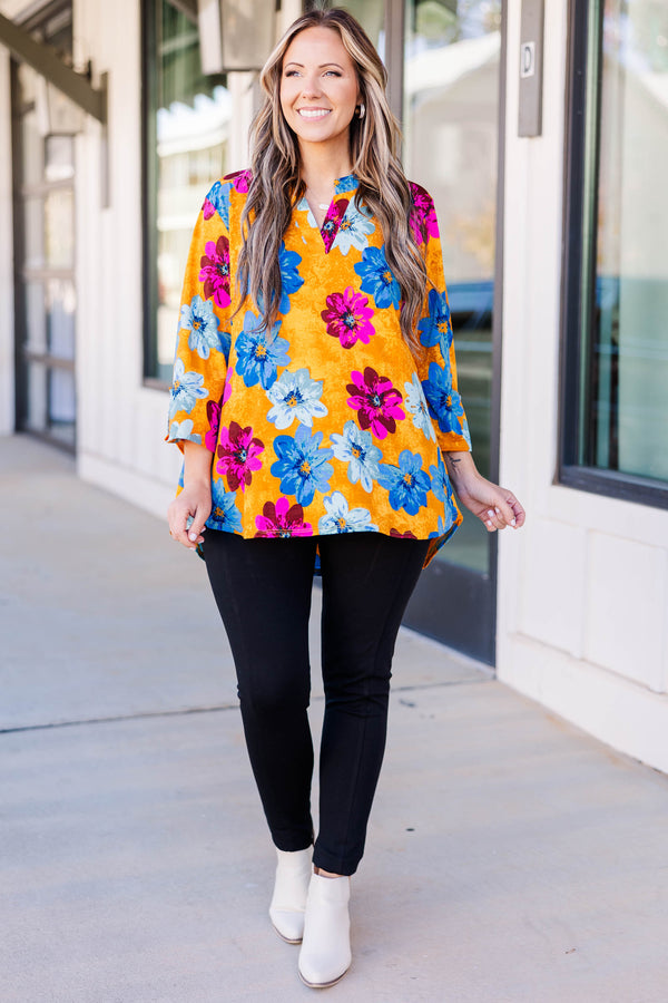Chic soul plus size boutique, golden yellow floral top with magenta, deep blue, and light blue floral print, 3/4 quarter length sleeves, v-neck slit at the top