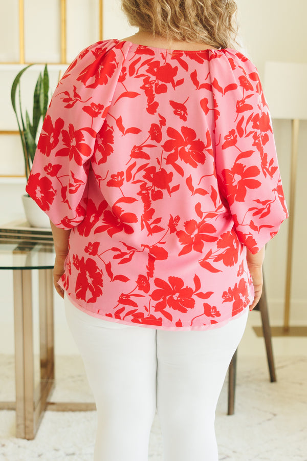 Chic Soul plus size clothing, pink flowy blouse with red floral pattern and bubble sleeves