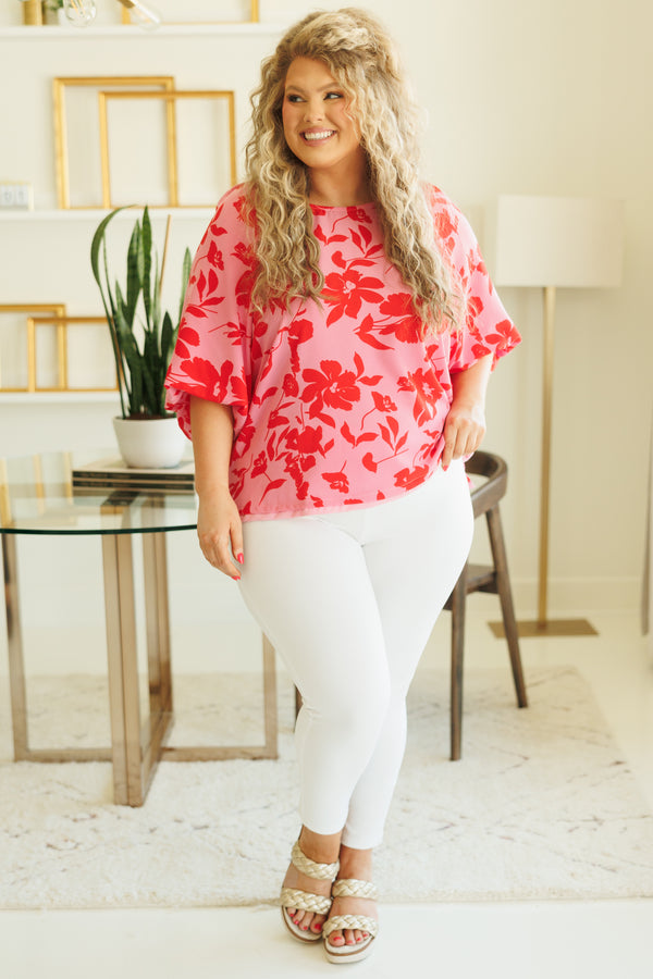 Chic Soul plus size clothing, pink flowy blouse with red floral pattern and bubble sleeves