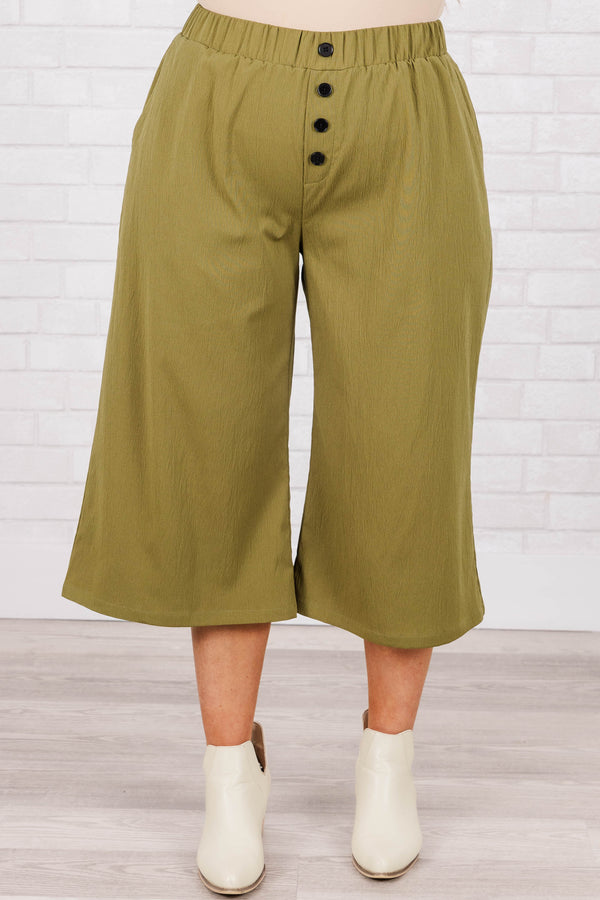Plus Size olive green wide-leg cropped pants with an elastic waistband and four front buttons.