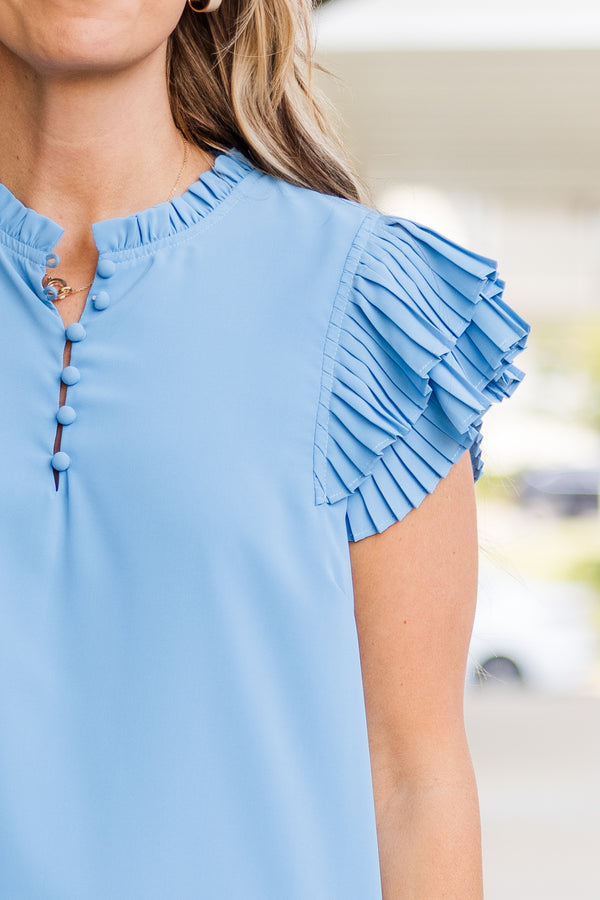 Plus Size blue top with accordion flutter sleeves and a button-up neckline.