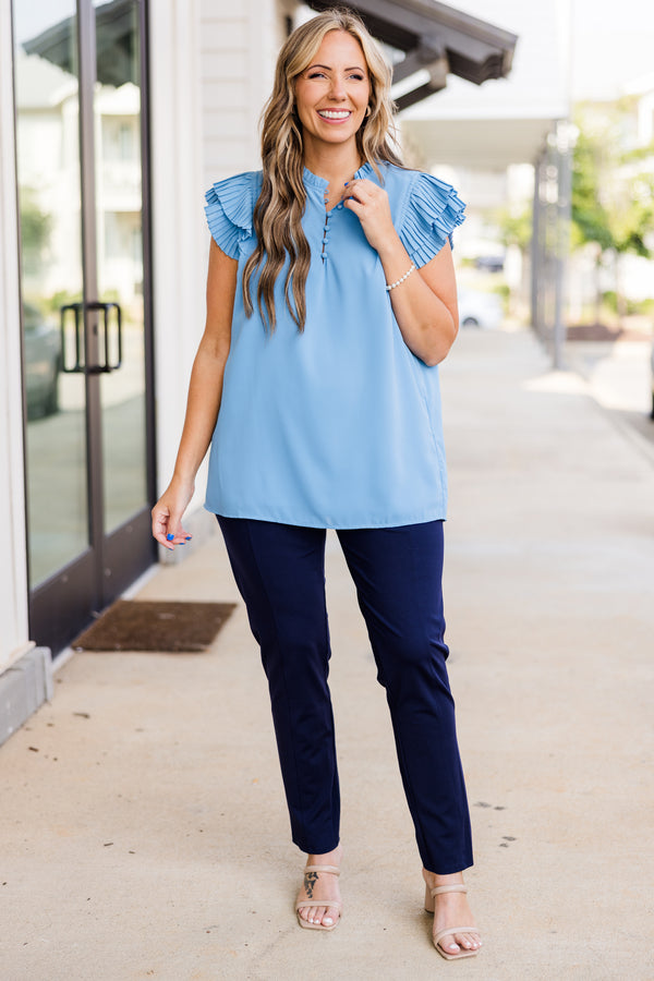 Plus Size blue top with accordion flutter sleeves and a button-up neckline.