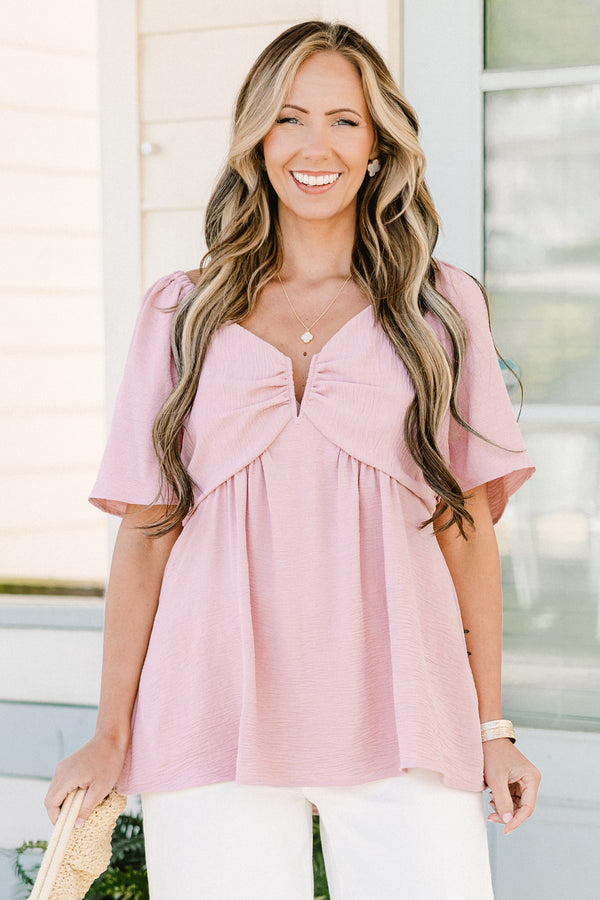 Plus Size dusty pink babydoll top with short flutter sleeves and a v-neckline.