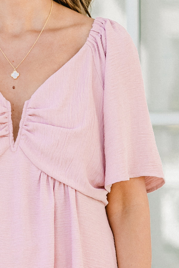 Plus Size dusty pink babydoll top with short flutter sleeves and a v-neckline.