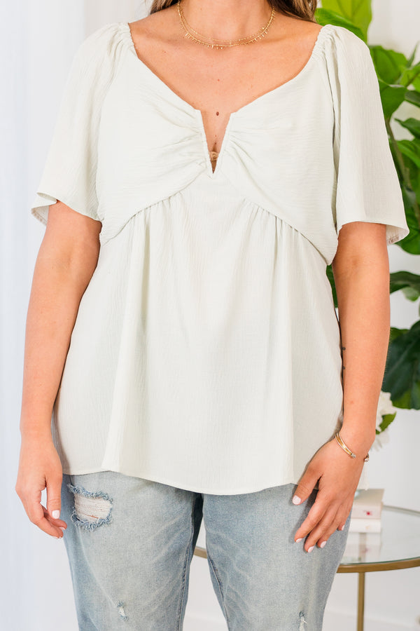 Chic Soul plus size clothing, short sleeve light sage top with small v-neck detail and puffed sleeves